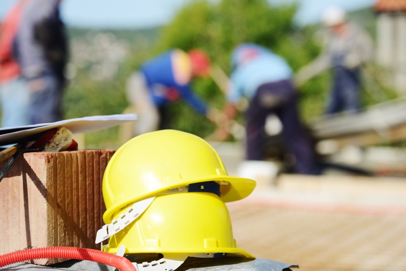Workplace safety: Working and building on new house project.